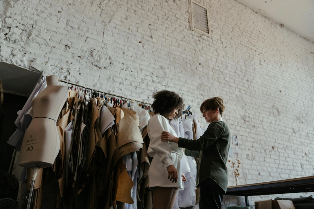 Clothing Business owner fitting a client